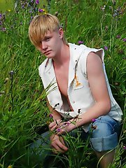 Blonde teen boy shows off his sexy body outdoors